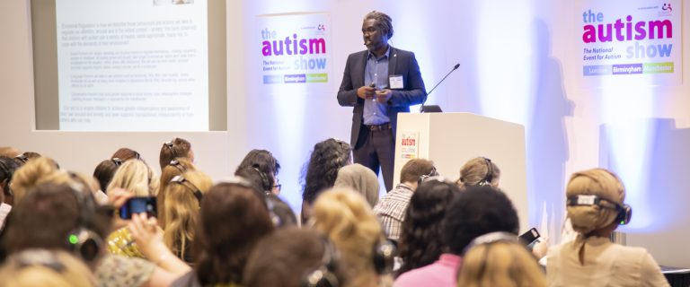 Speaker talking to crowed at Autism Show