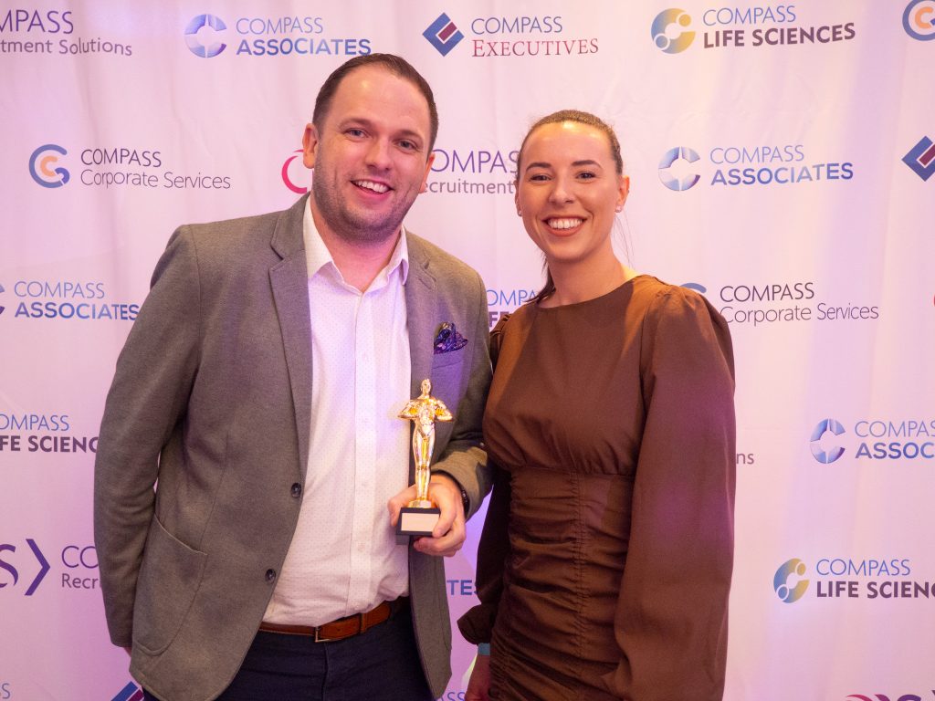 Compass Associates - Compass Core Values Awards 2022 - Jon Mondey winning award being presented to him by Head of HR Cassie Pay 