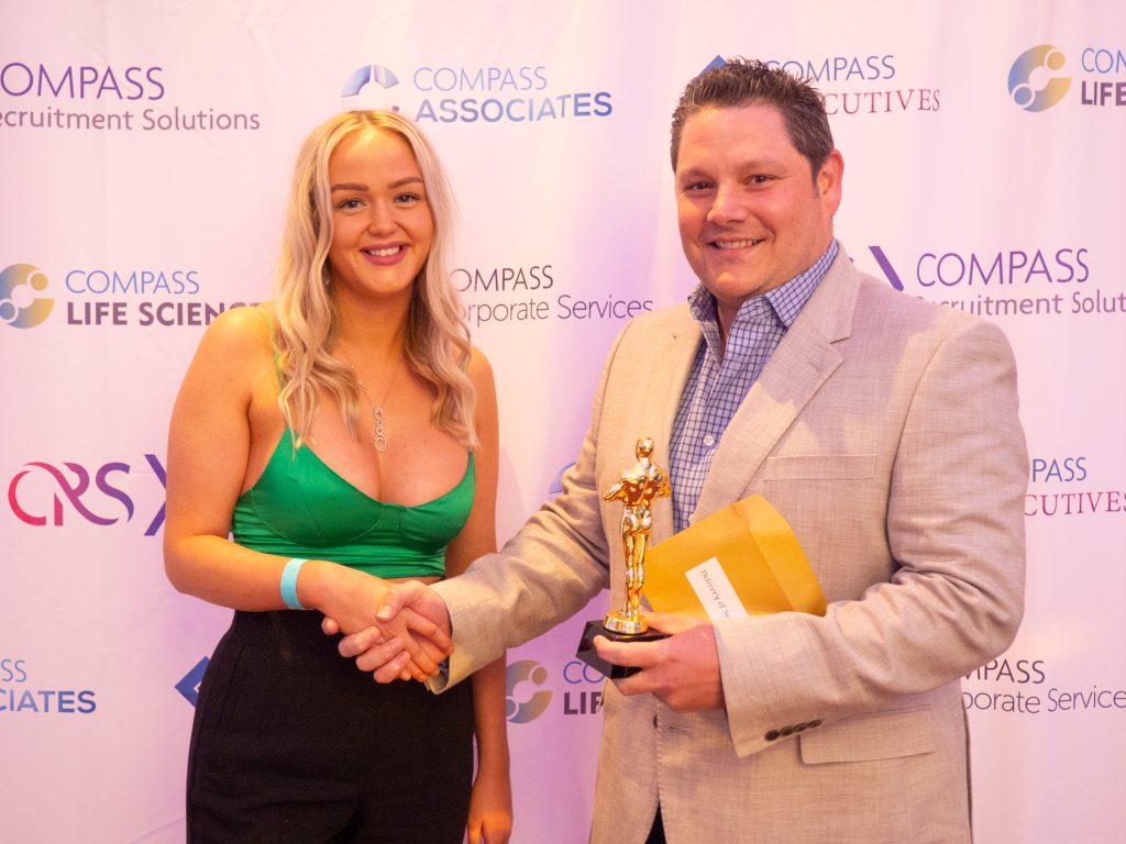 Compass Associates - Compass Core Values Awards 2022 - Photo of Lily Bulbeck being presented award by Mike Jeffreys